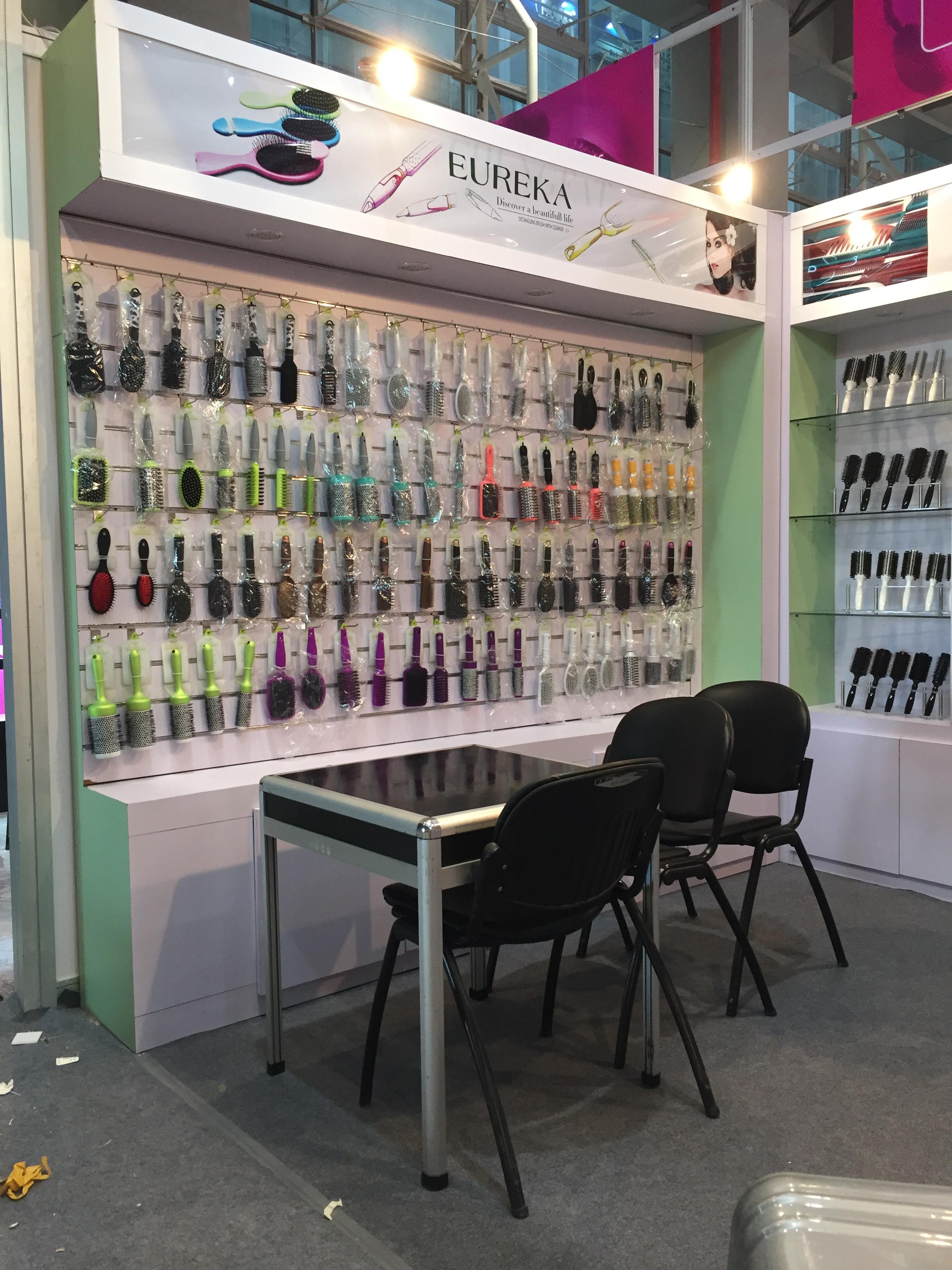 Vertical view of an Eureka hairbrush display and meeting table at the Canton Fair